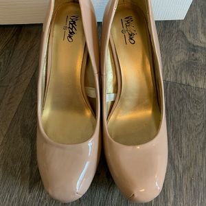 Nude patent leather heels